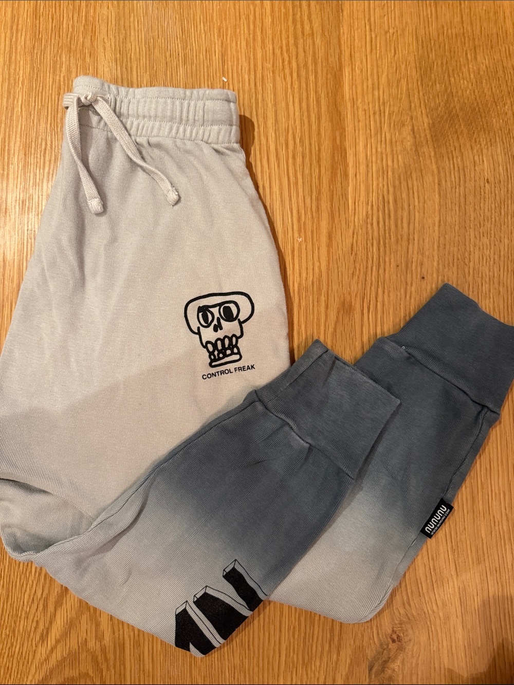 nununu Gray drop crotch Sweatpants with Skull Motif